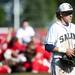 Saline second baseman Andrew White walks back to the dugout after losing to Bedford on Monday, June 3. Daniel Brenner I AnnArbor.com
